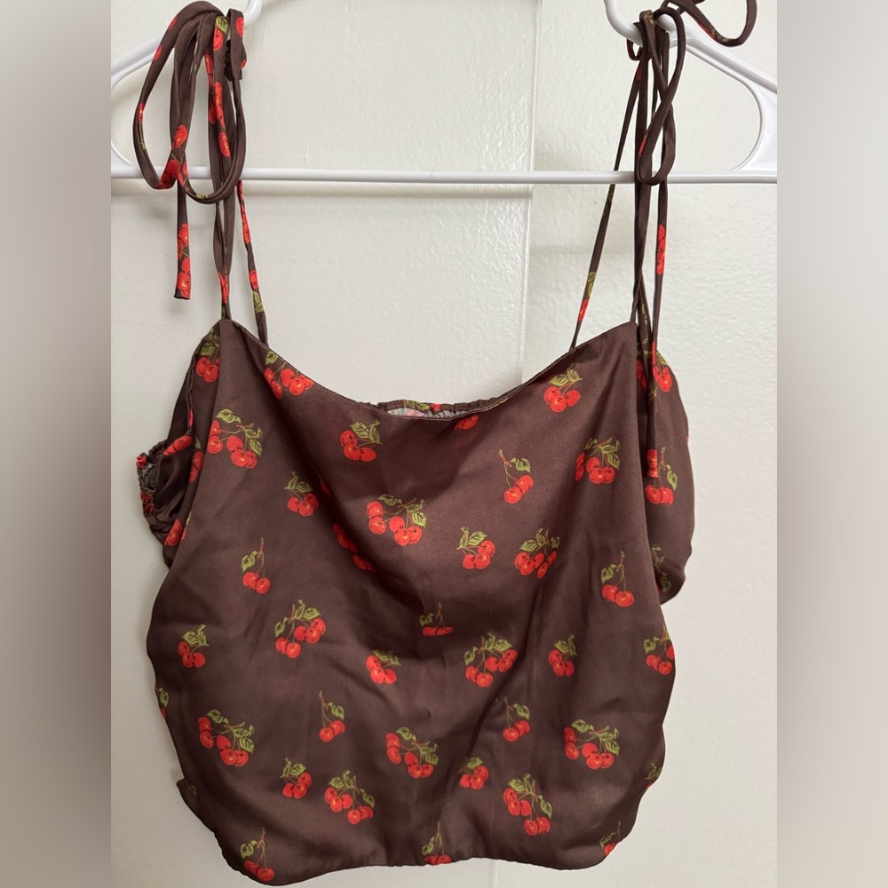 Brown tank with cherries